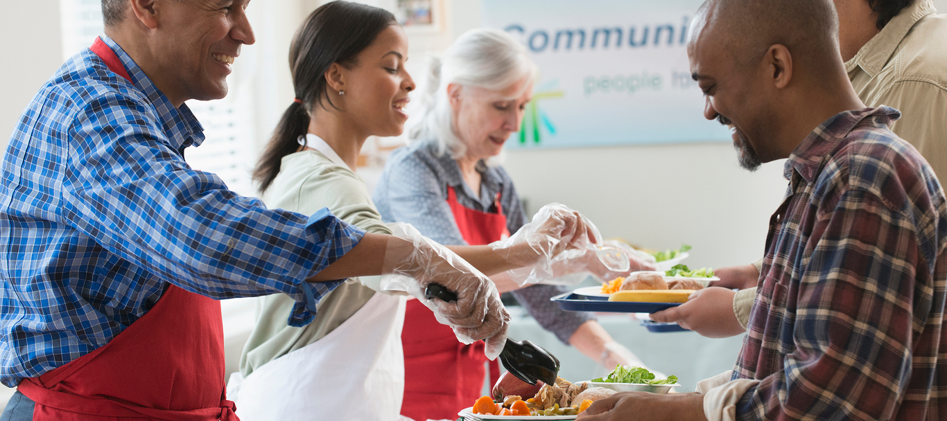 Volunteers serving food.