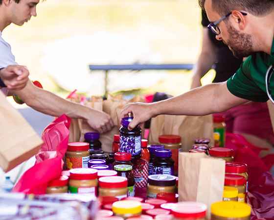 Associates volunteering to make peanut butter and jelly kits